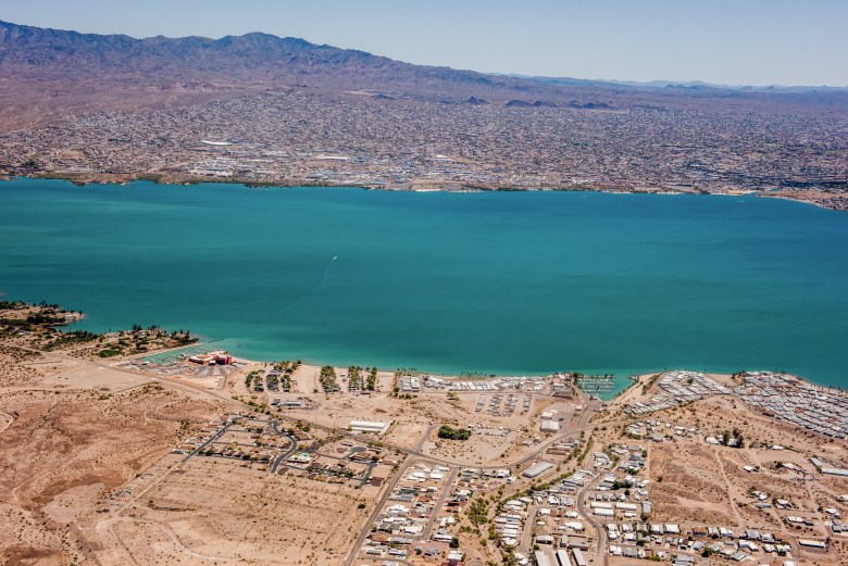 The Chemehuevi Reservation in the foreground, with Lake Havasu City in the background. The reservation fronts about 30 miles of the Colorado River, yet 97% of the tribe’s water remains in the river. 