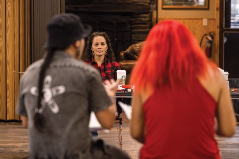Larissa FastHorse watches Wicoun cast members during rehearsals at Placerville Camp.