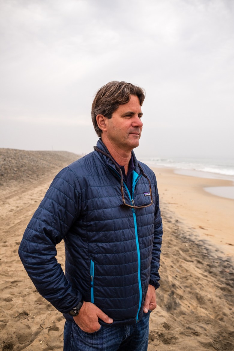 Former mayor Serge Dedina watches the surf in Imperial Beach, California, in 2018.