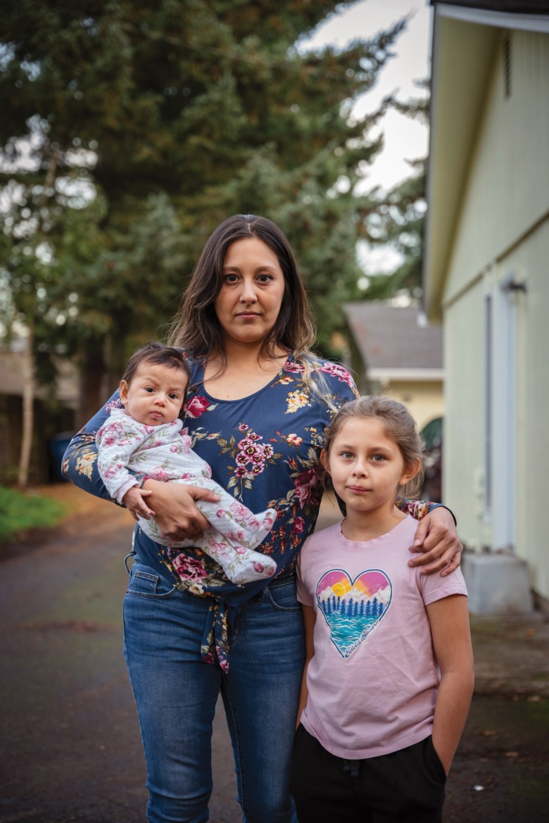 Sarah Ferris with her daughters, 4-month-old Ruby and Avigail, 7, outside their home in Vancouver, Washington, last November.