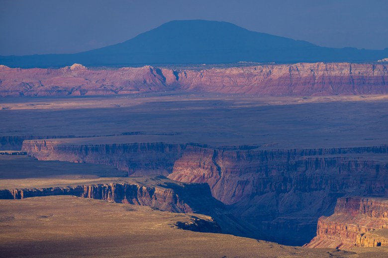 Sunset atop the Kaibab Plateau looking into Marble Canyon and Navajo Mountain.