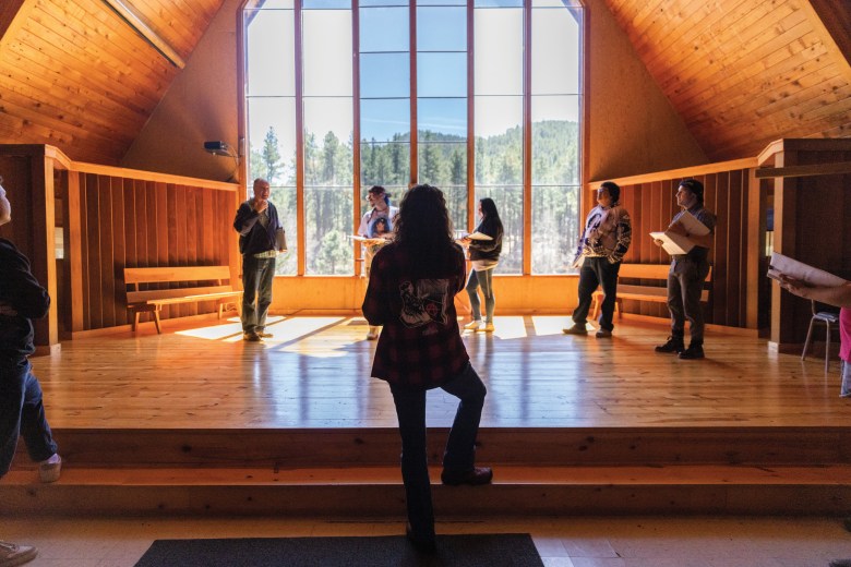 FastHorse, center, and cast members gather at work in the chapel.