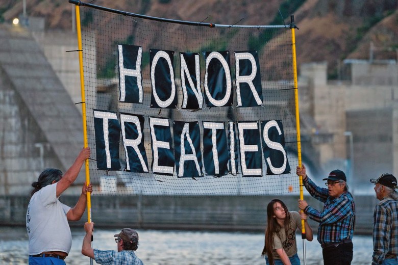 Members of Nimíipuu Protecting the Environment, a nonprofit run by members of the Nez Perce Tribe, protest at Lower Granite Dam. The tribe and three other tribal nations took part in the negotiations to reach an agreement among the tribes, the federal government, two states and several conservation groups.