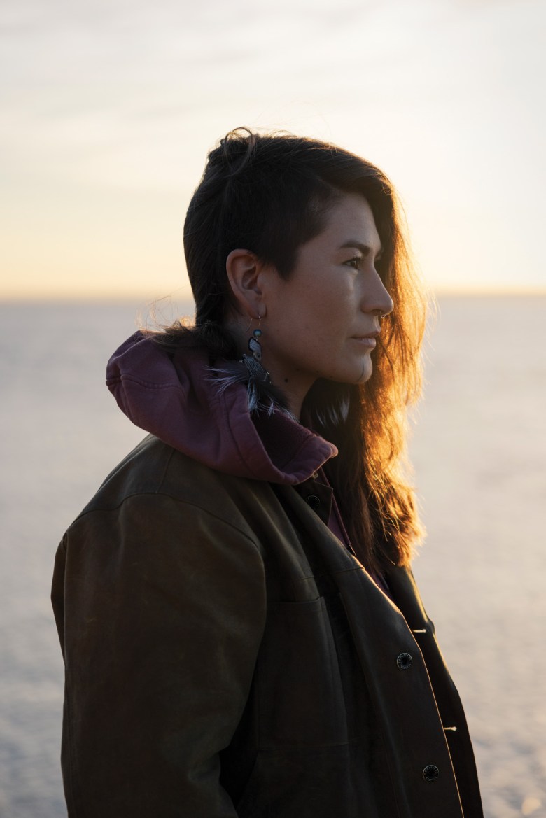 Deenaalee Chase-Hodgdon watches the sun rise at the confluence of the Wood and Nushagak rivers at Bristol Bay. In 2023, 16.9 million sockeye salmon returned to spawn in these rivers, and 12 million were caught by commercial and subsistence fishermen. Chase-Hodgdon wants to share Bristol Bay’s abundance with Yukon River communities whose fish runs have been decimated.