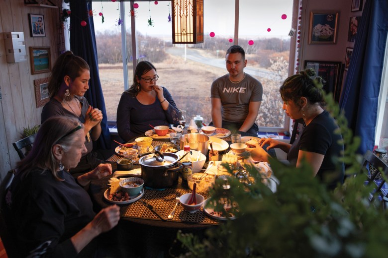 Chase-Hodgdon gathers with community members over traditional foods, including moose head soup. The meal provided an opportunity to share updates on the collective’s progress, and to seek ideas and input from people who live in the Bristol Bay region. The collective aims to build its operations with “patience for the pace of trust — the pace (at which) our community is able to manifest this in a responsible way,” Miller said. 