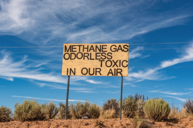  A sign along Highway 550, east of the Navajo Nation in New Mexico, near Lybrook Elementary School, alerts people to the presence of methane from the extensive network of fracking installations in the area.