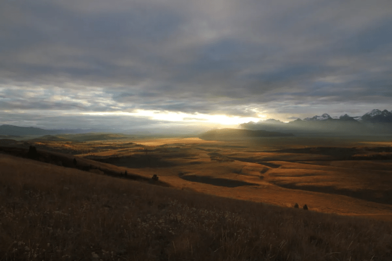 The last rays of sunshine cast down on a state school trust property known as the Kelly Parcel in October 2023. An inholding of Grand Teton National Park, the parcel has been proposed to go to public auction with an appraised value of $62.4 million.