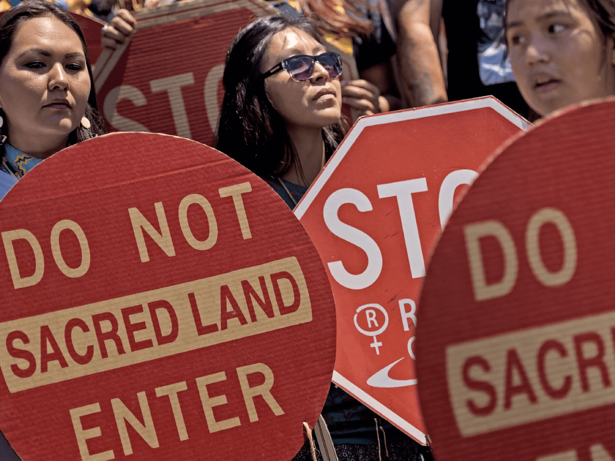 Protesters demonstrate against a massive copper mine at Chi’chil Bildagoteel, also known as Oak Flat.